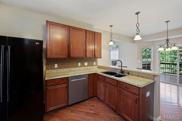 1305 Monarch Lake Ln, Shiloh, IL 62221 - kitchen with freestanding refrigerator, dishwasher, a peninsula, and dark wood-style flooring