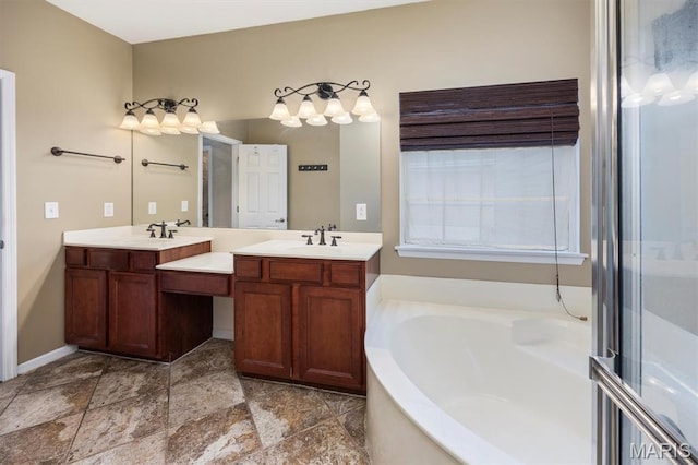 1305 Monarch Lake Ln, Shiloh, IL 62221 - bathroom with double vanity, a garden tub, and stone finish flooring