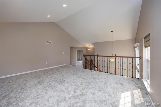 1305 Monarch Lake Ln, Shiloh, IL 62221 - carpeted empty room featuring high vaulted ceiling, a chandelier, and recessed lighting