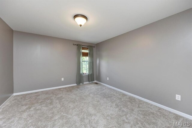1305 Monarch Lake Ln, Shiloh, IL 62221 - carpeted empty room featuring baseboards