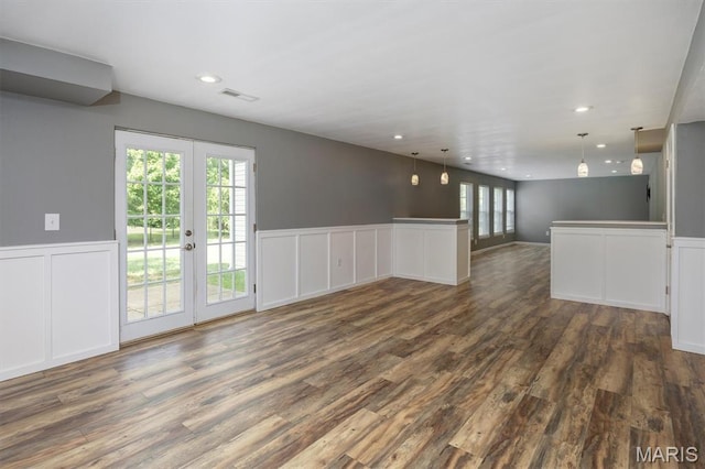1305 Monarch Lake Ln, Shiloh, IL 62221 - spare room featuring a decorative wall, dark wood-type flooring, a wainscoted wall, french doors, and recessed lighting