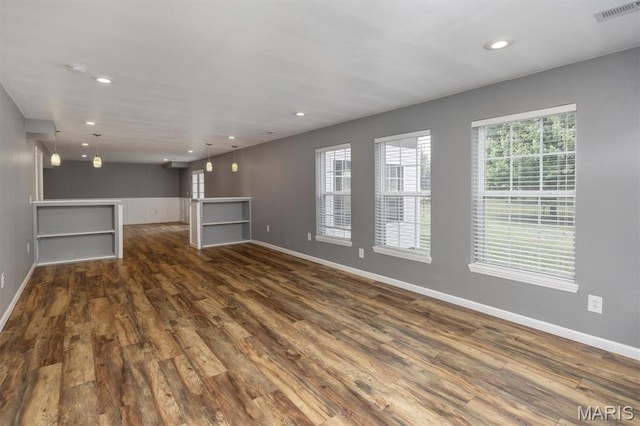 1305 Monarch Lake Ln, Shiloh, IL 62221 - unfurnished living room featuring dark wood-style flooring and recessed lighting