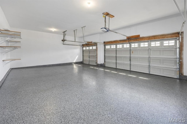 1305 Monarch Lake Ln, Shiloh, IL 62221 - garage featuring a garage door opener and baseboards