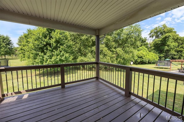 1305 Monarch Lake Ln, Shiloh, IL 62221 - deck with a trampoline, a yard, and view of scattered trees