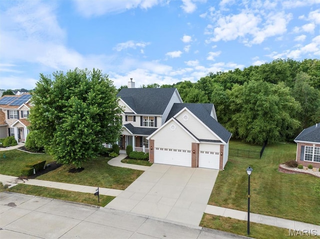 1305 Monarch Lake Ln, Shiloh, IL 62221 - view of front of house featuring concrete driveway, brick siding, and an attached garage