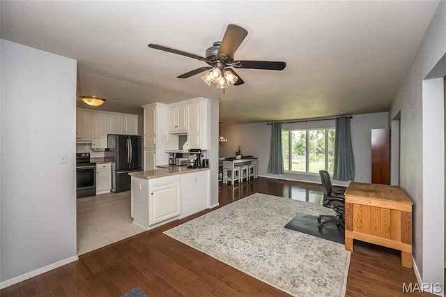 3644 Crestview Dr, Hillsboro, MO 63050 - kitchen featuring freestanding refrigerator, stainless steel range with electric stovetop, white cabinetry, and an office area