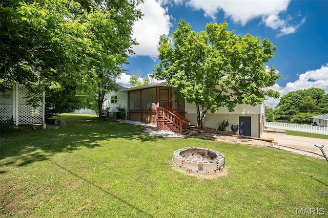 3644 Crestview Dr, Hillsboro, MO 63050 - view of green lawn featuring a sunroom, an outdoor fire pit, and stairs