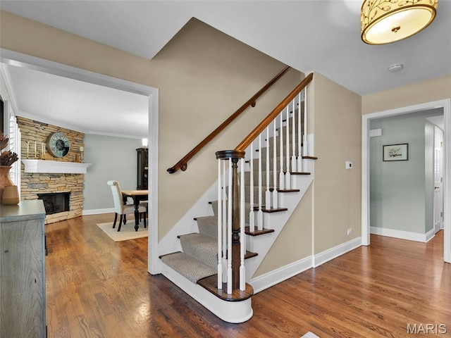 1571 Yarmouth Point Dr, Chesterfield, MO 63017 - staircase featuring wood finished floors and a stone fireplace