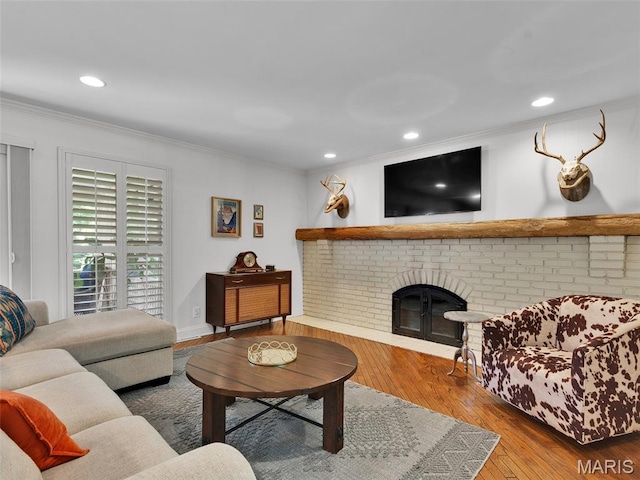 1571 Yarmouth Point Dr, Chesterfield, MO 63017 - living area featuring crown molding, hardwood / wood-style flooring, recessed lighting, and a brick fireplace