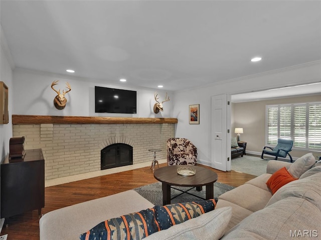 1571 Yarmouth Point Dr, Chesterfield, MO 63017 - living room featuring ornamental molding, a fireplace, recessed lighting, and wood finished floors