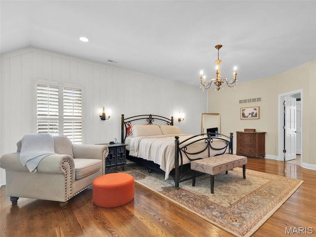 1571 Yarmouth Point Dr, Chesterfield, MO 63017 - bedroom featuring wood finished floors, a chandelier, and vaulted ceiling