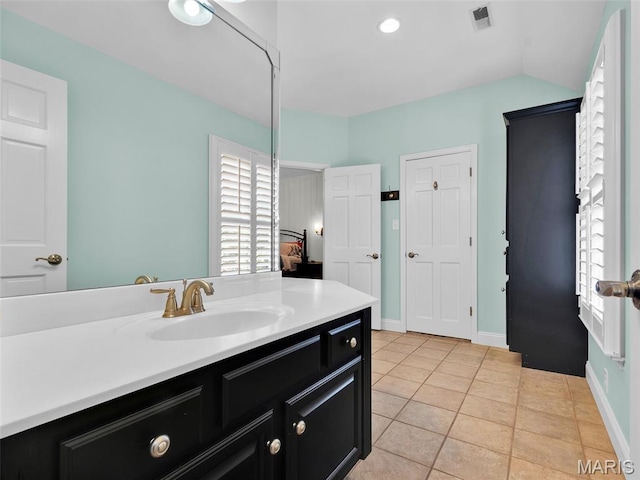 1571 Yarmouth Point Dr, Chesterfield, MO 63017 - bathroom featuring vanity, tile patterned flooring, and lofted ceiling