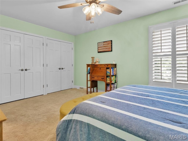 1571 Yarmouth Point Dr, Chesterfield, MO 63017 - bedroom featuring multiple closets, carpet flooring, and a ceiling fan