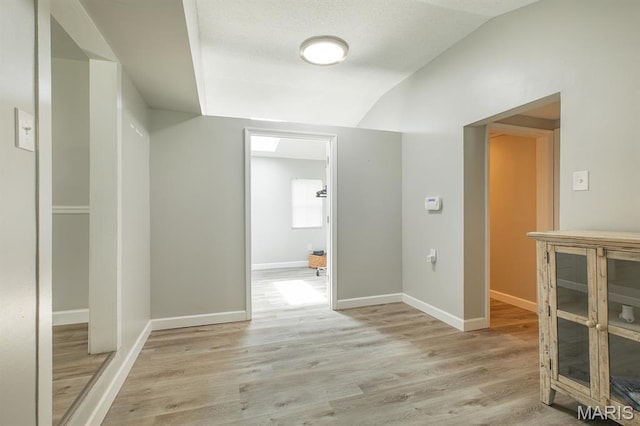 250 Hi Pointe Pl, East Alton, IL 62024 - corridor with lofted ceiling and light wood-style floors