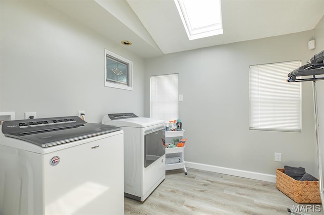 250 Hi Pointe Pl, East Alton, IL 62024 - laundry room featuring washer and clothes dryer, light wood finished floors, and a skylight