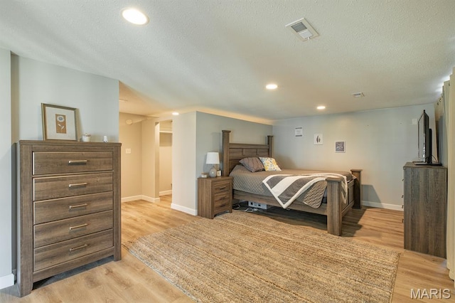 250 Hi Pointe Pl, East Alton, IL 62024 - bedroom with a textured ceiling, light wood-style floors, and recessed lighting