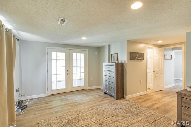250 Hi Pointe Pl, East Alton, IL 62024 - spare room with french doors, light wood finished floors, a textured ceiling, and recessed lighting