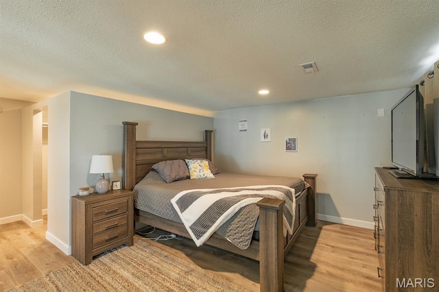250 Hi Pointe Pl, East Alton, IL 62024 - bedroom with light wood-style flooring, a textured ceiling, and recessed lighting