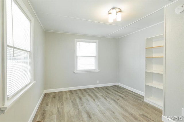 250 Hi Pointe Pl, East Alton, IL 62024 - empty room featuring light wood finished floors, a smoke detector, and crown molding