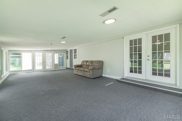 250 Hi Pointe Pl, East Alton, IL 62024 - unfurnished room with french doors, carpet flooring, and a textured ceiling