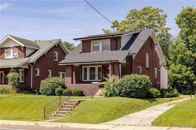 1105 Pennsylvania Ave, Saint Louis, MO 63130 - view of front of home with brick siding, roof with shingles, and a front yard