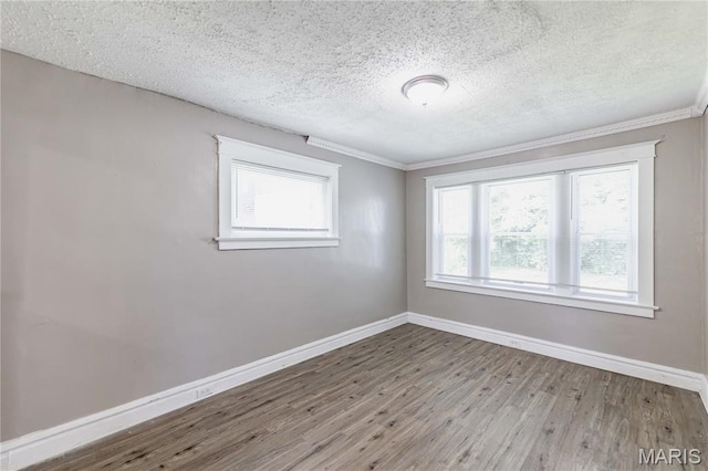 1105 Pennsylvania Ave, Saint Louis, MO 63130 - unfurnished room with wood finished floors, a textured ceiling, and ornamental molding