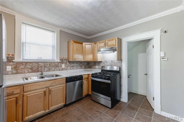1105 Pennsylvania Ave, Saint Louis, MO 63130 - kitchen featuring appliances with stainless steel finishes, under cabinet range hood, light countertops, backsplash, and dark tile patterned floors