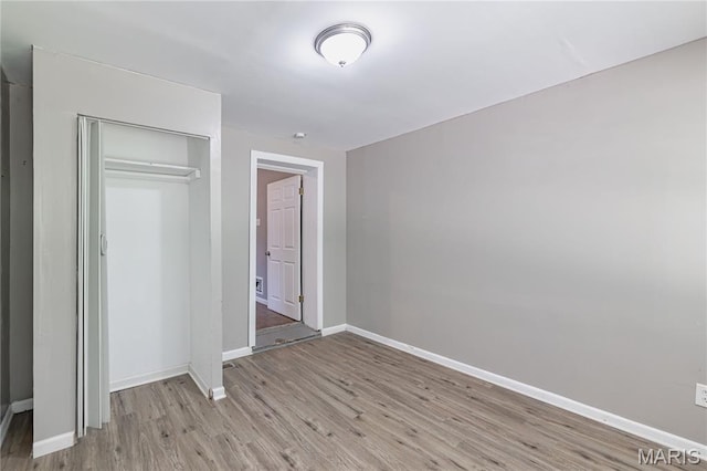 1105 Pennsylvania Ave, Saint Louis, MO 63130 - unfurnished bedroom featuring light wood-style floors and a closet