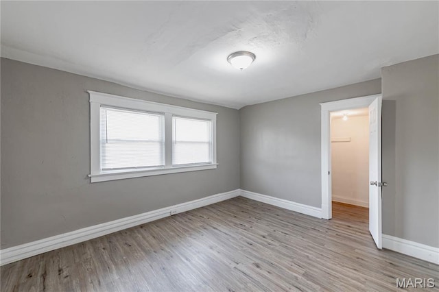 1105 Pennsylvania Ave, Saint Louis, MO 63130 - spare room with baseboards and wood finished floors