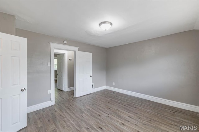 1105 Pennsylvania Ave, Saint Louis, MO 63130 - empty room with wood finished floors and baseboards