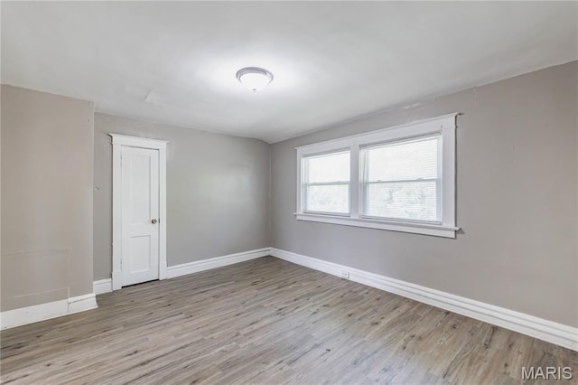 1105 Pennsylvania Ave, Saint Louis, MO 63130 - spare room featuring wood finished floors and baseboards