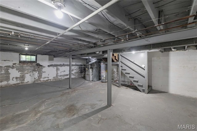 1105 Pennsylvania Ave, Saint Louis, MO 63130 - basement with stairway, heating unit, and water heater