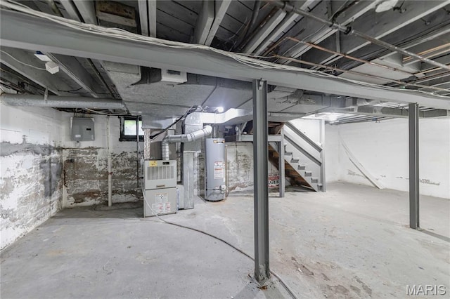 1105 Pennsylvania Ave, Saint Louis, MO 63130 - below grade area featuring water heater, stairs, electric panel, and heating unit