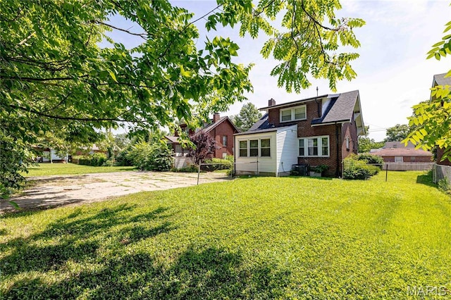 1105 Pennsylvania Ave, Saint Louis, MO 63130 - view of front of home with brick siding and a chimney