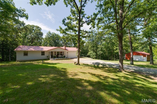 8870 State Road Nn, Cedar Hill, MO 63016 - view of grassy yard with driveway and a garage