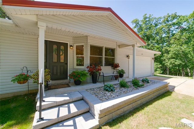 8870 State Road Nn, Cedar Hill, MO 63016 - property entrance featuring covered porch, a garage, and driveway