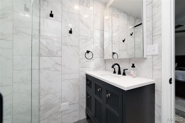 8870 State Road Nn, Cedar Hill, MO 63016 - bathroom with vanity and tile walls