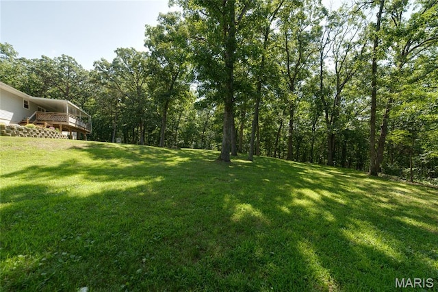 8870 State Road Nn, Cedar Hill, MO 63016 - view of grassy yard featuring a wooden deck and a forest view