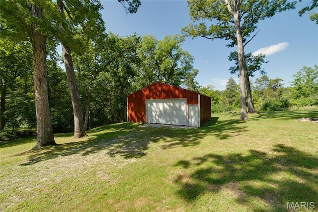 8870 State Road Nn, Cedar Hill, MO 63016 - view of green lawn with a detached garage, an outbuilding, and driveway
