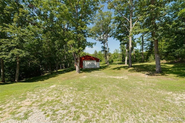 8870 State Road Nn, Cedar Hill, MO 63016 - view of grassy yard featuring an outdoor structure, a pole building, and a garage
