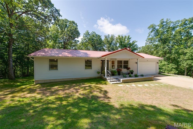 8870 State Road Nn, Cedar Hill, MO 63016 - ranch-style home with an attached garage, concrete driveway, a front yard, a metal roof, and a chimney