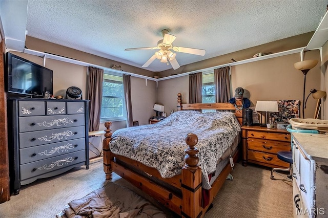 30053 Emily Ln, Lebanon, MO 65536 - bedroom featuring carpet, a textured ceiling, and a ceiling fan