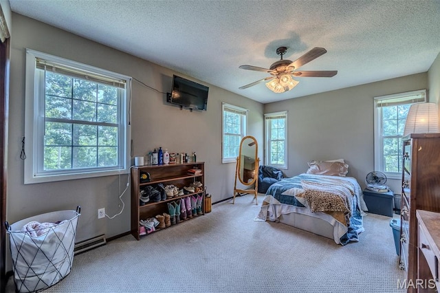 30053 Emily Ln, Lebanon, MO 65536 - bedroom with multiple windows, carpet, a textured ceiling, and ceiling fan