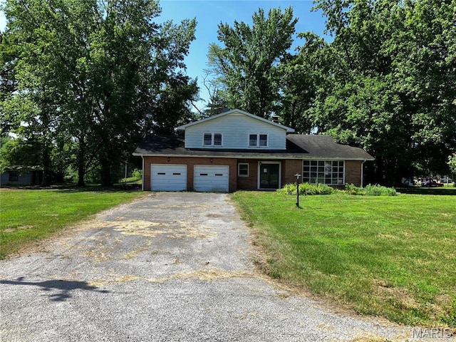 4612 Wood Duck Rd, Pinckneyville, IL 62274 - view of front of home featuring asphalt driveway, brick siding, and a front lawn