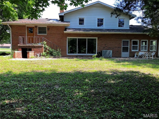 4612 Wood Duck Rd, Pinckneyville, IL 62274 - back of property with brick siding, a lawn, and stairs