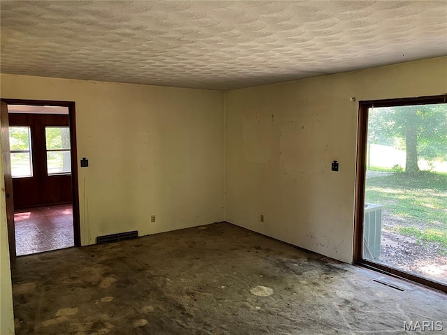 4612 Wood Duck Rd, Pinckneyville, IL 62274 - spare room with a textured ceiling and concrete floors