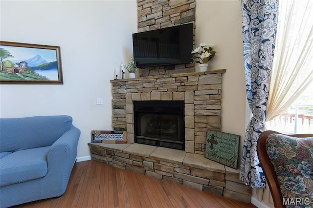 11907 Pine Forest Dr, Rolla, MO 65401 - living room featuring a fireplace and wood finished floors