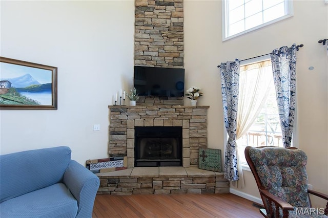 11907 Pine Forest Dr, Rolla, MO 65401 - living room with wood finished floors and a fireplace