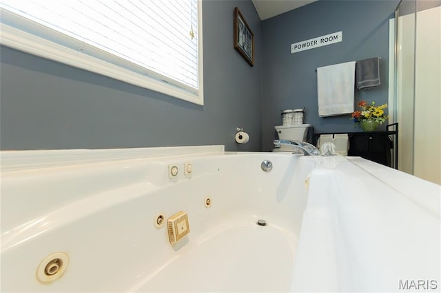 11907 Pine Forest Dr, Rolla, MO 65401 - bathroom featuring a tub with jets