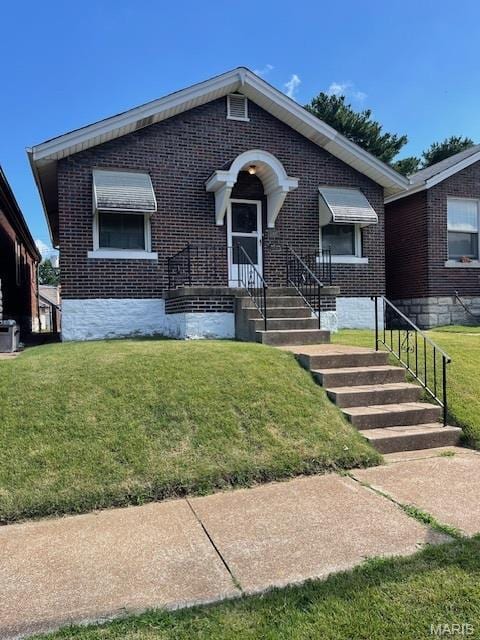 5461 Eichelberger St, Saint Louis, MO 63109 - view of front of home with brick siding and a front yard